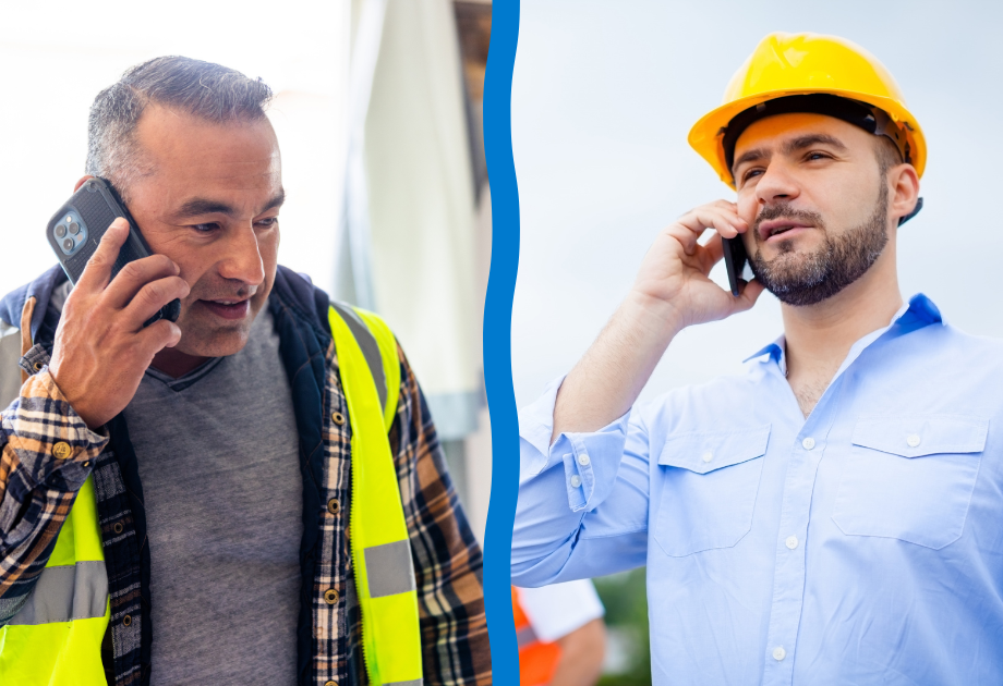 Two construction professionals in hard hats and safety vests reviewing project documents at a job site beside heavy construction equipment during a site inspection.